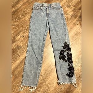 Express size 4R with black crochet flowers on leg